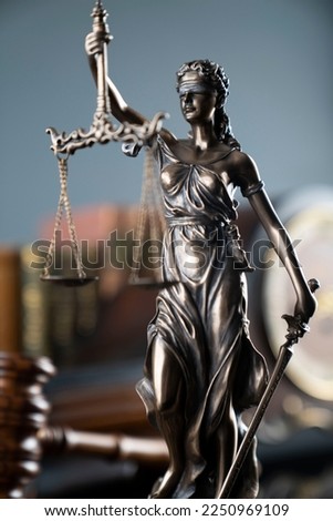 Law and justice symbols, books and vintage clock on grey background.