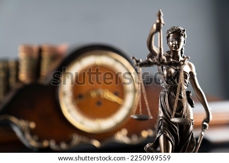 Law and justice symbols, books and vintage clock on grey background.