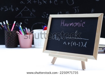 Blackboard with hand written Sequences and Series Formulas and geometric shapes and figures