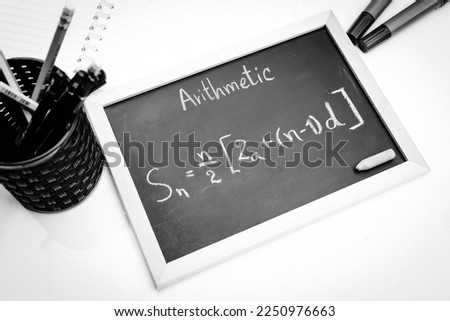 Blackboard with hand written Sequences and Series Formulas and geometric shapes and figures Royalty-Free Stock Photo #2250976663