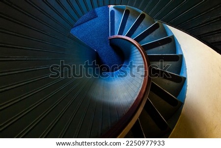 high angle photography of blue spiral staircase blue and black spiral staircase