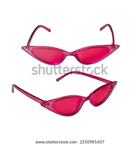 Pink plastic sunglasses in the shape of a cat's eye, black lenses isolated on a white background with a cut-off track. Stylish retro sunglasses. Royalty-Free Stock Photo #2250981607