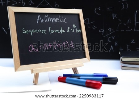 Blackboard with hand written Sequences and Series Formulas and geometric shapes and figures Royalty-Free Stock Photo #2250983117