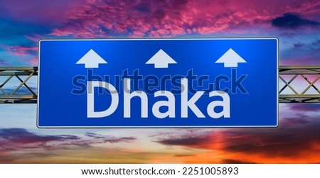 Road sign indicating direction to the city of Dhaka.