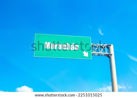 The name Maranhão referring to a Brazilian state written on a green traffic sign.

