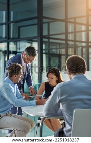 Man, tablet and business people in meeting for coaching, goals and mission at desk for discussion. Teamwork, woman and strategy for vision, collaboration or innovation in financial company with coach Royalty-Free Stock Photo #2251018237