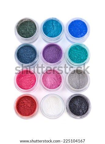 Set of colorful mineral eye shadows, top view isolated on white background 