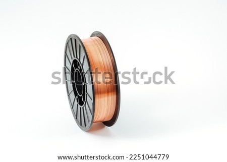Welding wire spool on a white background. Royalty-Free Stock Photo #2251044779