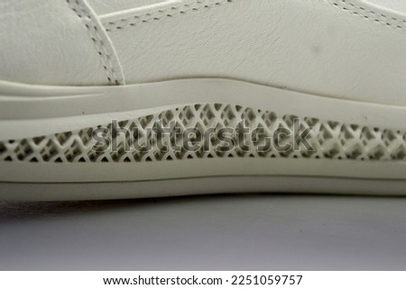 white shoe sole and stitch texture on white background