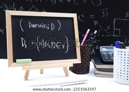 Blackboard with hand written Relations and Functions and formulas shapes and figures