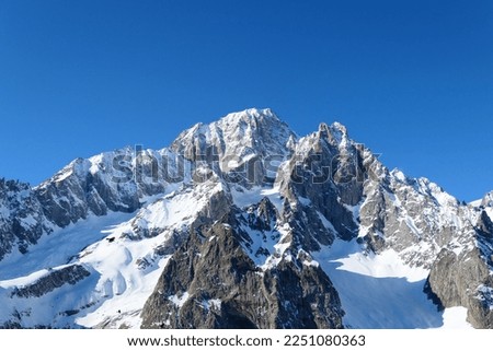 Mont Blanc mountain view from piste in Courmayeur ski resort. Italian Alps, Aosta Valley. Monte Bianco in Italy. Royalty-Free Stock Photo #2251080363