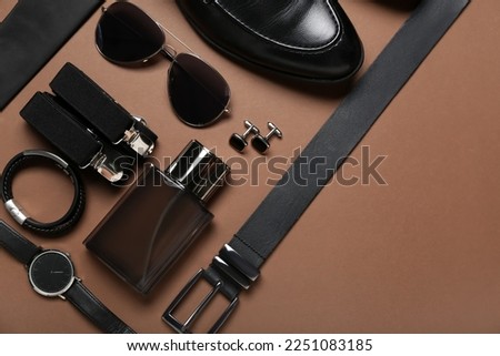 Stylish male accessories and shoes on brown background Royalty-Free Stock Photo #2251083185