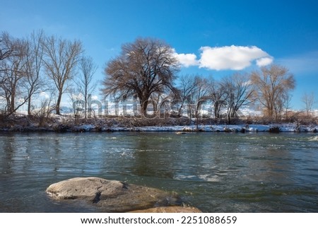 Truckee River at a park in Sparks, Nevada after a recent snowstorm in wintertime.