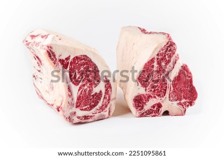 Raw dry aged wagyu porterhouse and cote de boeuf beef block as closeup on white background with copy space - free-from select 