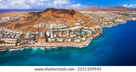 Lanzarote island, Playa Blanca resort. aerial drone panoramic view with Red volcano. Flamingo becah  Canary islands of Spain Royalty-Free Stock Photo #2251109945