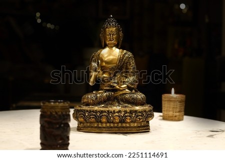 Buddha meditating made of brass