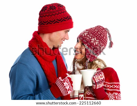 Christmas couple drinking hot tea isolated over white background.