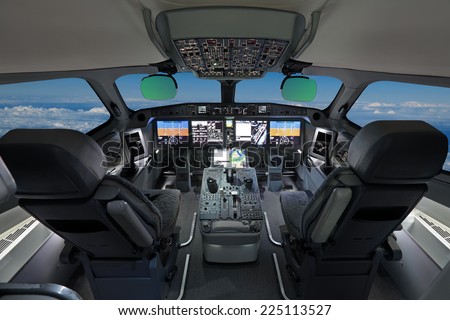 The cabin of the modern passenger airliner, nobody, autopilot, blue sky outside the window Royalty-Free Stock Photo #225113527