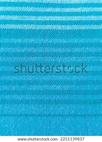 Background of natural ligth blue textile texture closeup