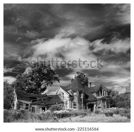 Abandoned house in black and white with a frame to looks like an used instant picture.