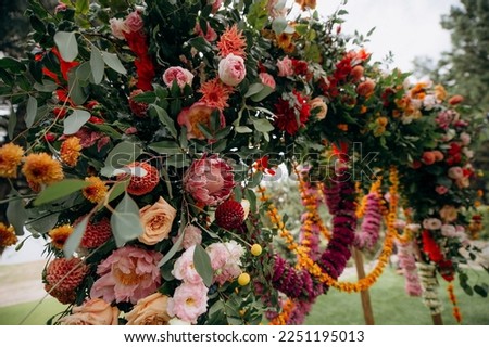 bright multicolored mexican style wedding floral decorations Royalty-Free Stock Photo #2251195013