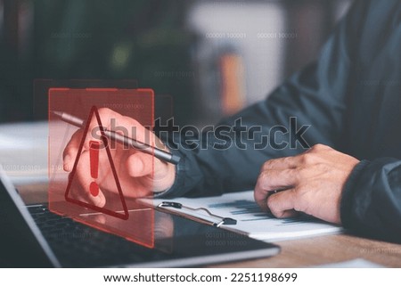 businessman and warning icon, exclamation mark,alarm,computer virus detected,danger warning concept or information error that should be urgently fixed and repaired,Notification of security issues Royalty-Free Stock Photo #2251198699