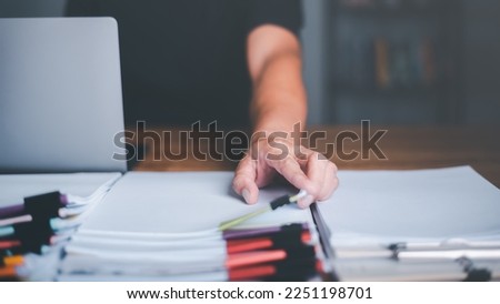 business accounting documents,auditor,management and auditing of office documents,Reports for Tax Time Analysis,office worker working with documents at home office desk,work at home Royalty-Free Stock Photo #2251198701