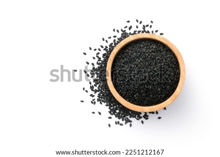 Black sesame seeds in wooden bowl with floor isolated on white background , top view , flat lay. Royalty-Free Stock Photo #2251212167