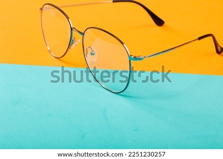 Sunglasses in studio shots with professional lighting and colorful background