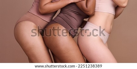 Legs, skincare and diversity of body positive women, natural beauty and wellness on studio. Group, models and thighs together in underwear for laser cosmetics, healthy glow or aesthetics of self care