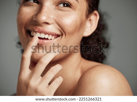 Woman, sugar scrub and lips with smile for skincare, makeup or cosmetics against a grey studio background. Happy female smiling in happiness for facial cosmetic, lip dermatology or mouth exfoliation Royalty-Free Stock Photo #2251266321