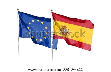 Spain flag and EU flag on cloudy sky. waving in the sky