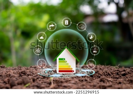 House model on land with clean energy icon. Eco-friendly house concept and energy-saving and eco-friendly house. Royalty-Free Stock Photo #2251296915