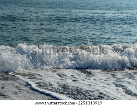 waves on a windy day on the beach in Antalya