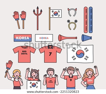 Korea's soccer cheering team Red Devils supporters. Supporting items and fans cheering.