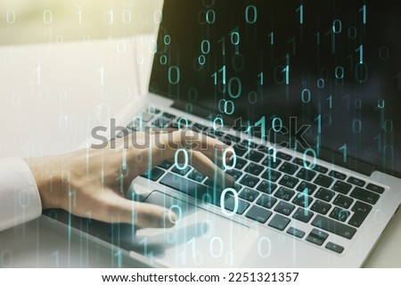 Creative abstract binary code hologram and hands typing on computer keyboard on background, AI and machine learning concept. Multiexposure