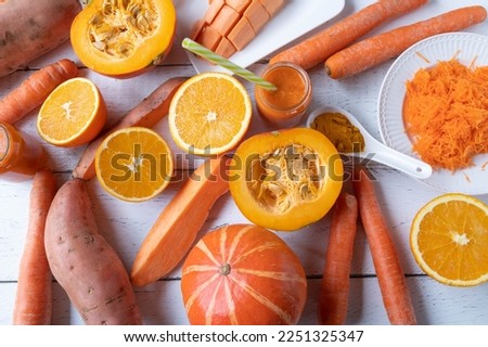 Vegetables and fruit with beta carotene or provitamin a such as oranges, sweet potatoes, squash or pumpkin and carrots Royalty-Free Stock Photo #2251325347