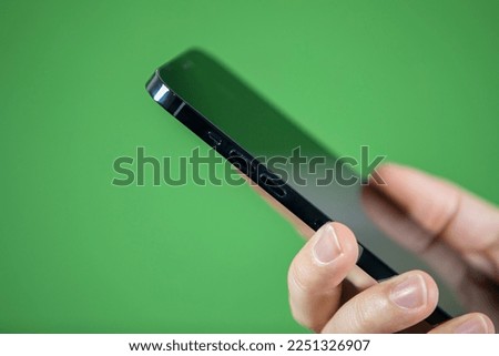 smart phone mute button green background 