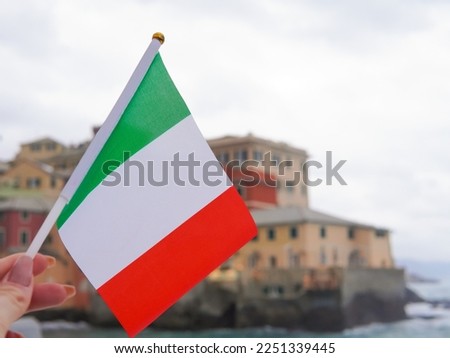 close up of tricolor national flag of Italy on seascape background