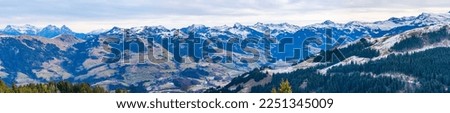 Panoramic aerial view of Alps and countryside surrounding Kitzbuhel in Austria Royalty-Free Stock Photo #2251345009