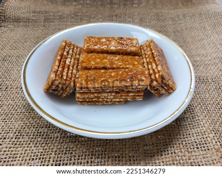 stack of ting ting enting enting indonesian traditional sweet peanut brown sugar candy snack  Royalty-Free Stock Photo #2251346279
