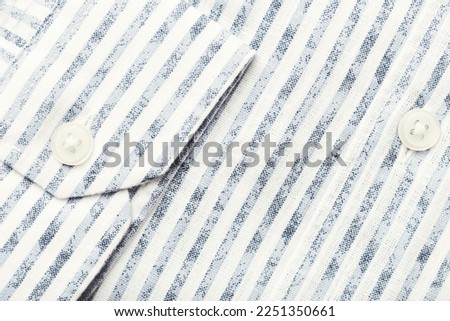 Close up of men's striped shirt.