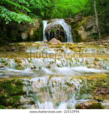 The beautiful waterfall in forest, spring,  long exposure