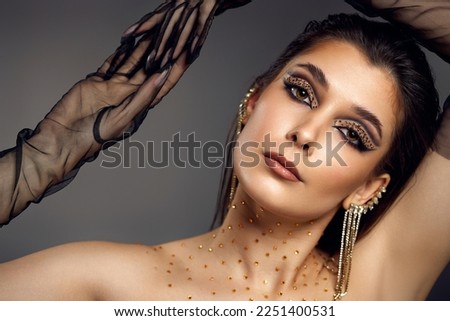 beauty bright eye makeup with arrows with rhinestones Royalty-Free Stock Photo #2251400531