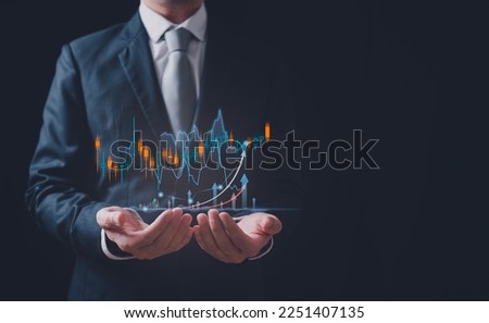 investment and financial planning and strategy, Stock market, Business growth, progress or success concept. Businessman or trader is showing a growing virtual hologram stock, invest in trading.