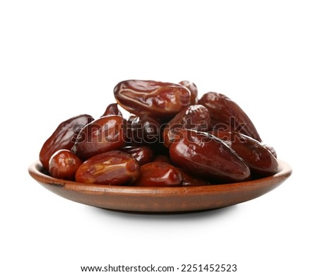 Plate with dried dates for Ramadan on white background Royalty-Free Stock Photo #2251452523