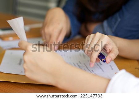 Business woman filling document agreement form in office. Royalty-Free Stock Photo #225147733