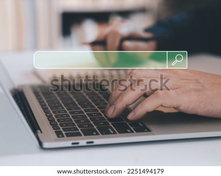 Online searching concept. Man typing in laptops to finding information or shopping online. Internet searching technology in virtual screen.