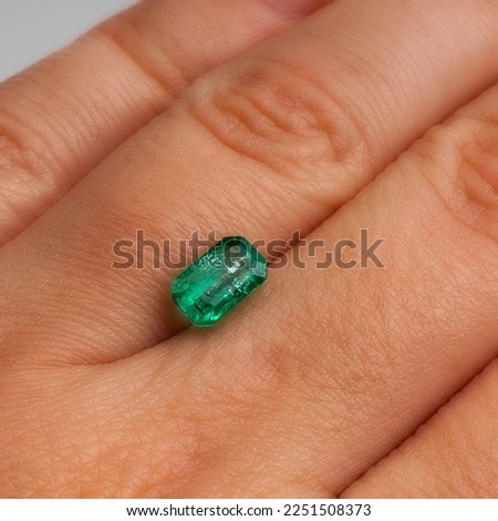 Emerald Gem. Natural Emerald on a hand. Natural Gemstone Green Emerald.  Royalty-Free Stock Photo #2251508373
