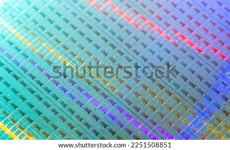Silicon monocrystalline wafer with microchips manufacturing used in fabrication of electronic integrated circuits.  Royalty-Free Stock Photo #2251508851
